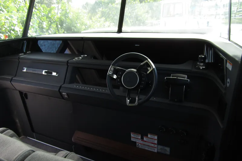  Yacht Photos Pics 2024 Axopar 45 XC Cross Cabin BRABUS Trim interior dashboard with steering wheel.
