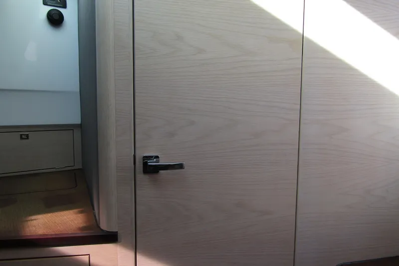  Yacht Photos Pics Interior view of 2024 Axopar 45 XC Cross Cabin BRABUS Trim, featuring sleek wooden paneling.