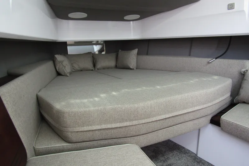  Yacht Photos Pics 2024 Axopar 45 XC Cross Cabin BRABUS Trim interior with cozy gray seating area.