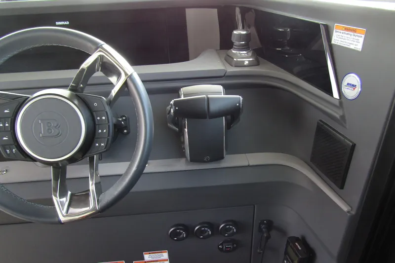  Yacht Photos Pics 2024 Axopar 45 XC Cross Cabin BRABUS Trim dashboard with steering wheel and controls.