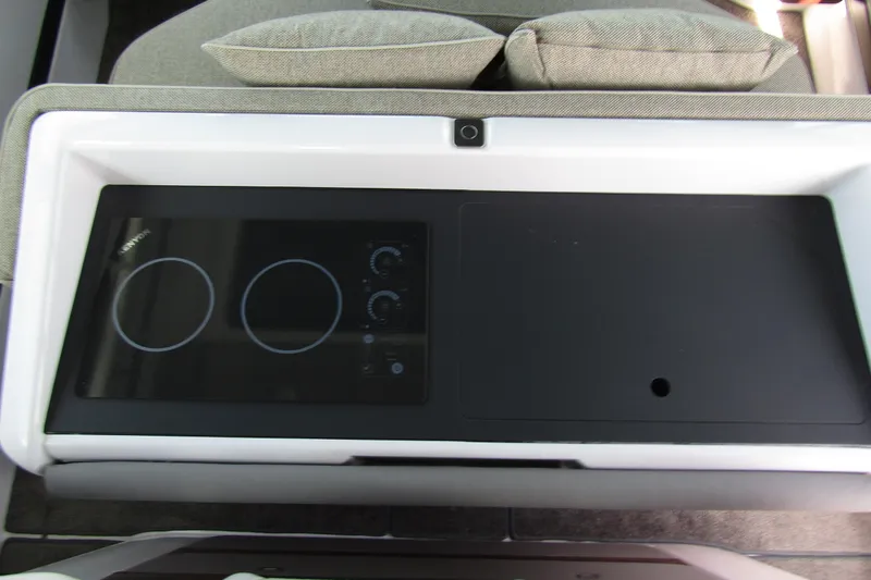  Yacht Photos Pics 2024 Axopar 45 XC Cross Cabin BRABUS Trim interior with modern stovetop.