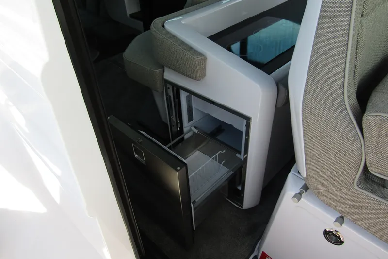  Yacht Photos Pics 2024 Axopar 45 XC Cross Cabin BRABUS Trim interior with open storage compartment.