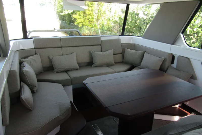  Yacht Photos Pics Luxurious interior of 2024 Axopar 45 XC Cross Cabin with plush seating and cushions.