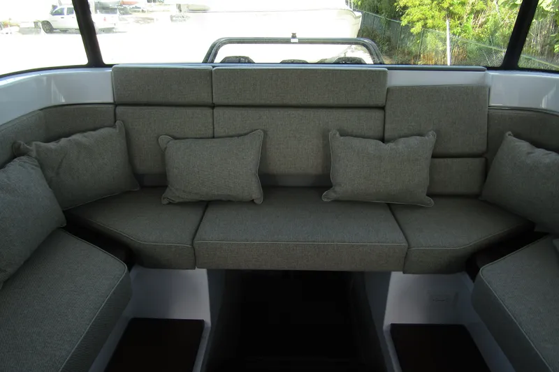  Yacht Photos Pics 2024 Axopar 45 XC Cross Cabin BRABUS Trim interior seating with gray cushions.