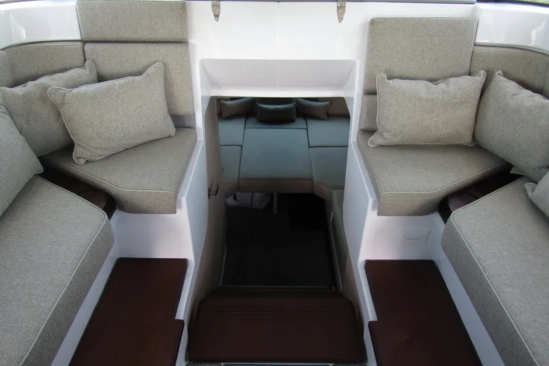  Yacht Photos Pics Interior seating of 2024 Axopar 45 XC Cross Cabin BRABUS Trim, featuring gray cushions.