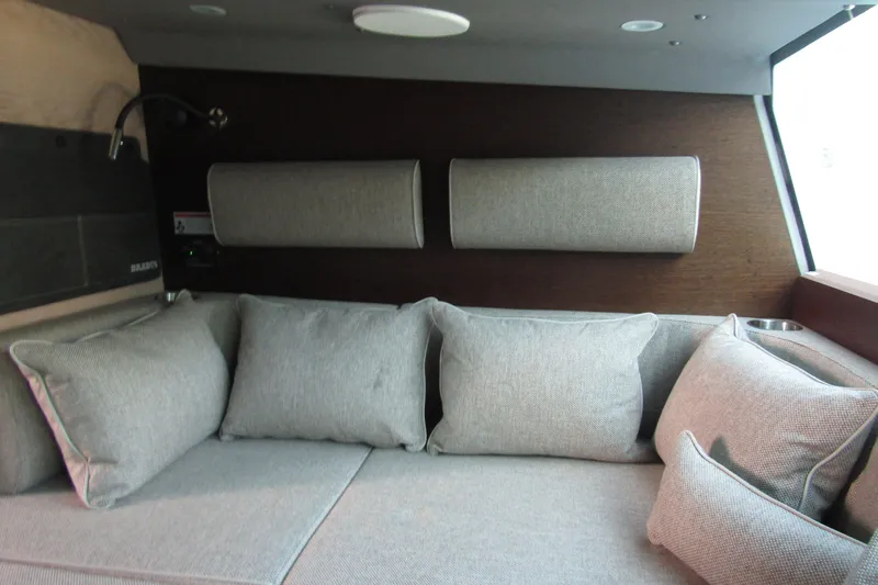  Yacht Photos Pics Luxurious interior of 2024 Axopar 45 XC Cross Cabin BRABUS Trim with plush gray cushions.