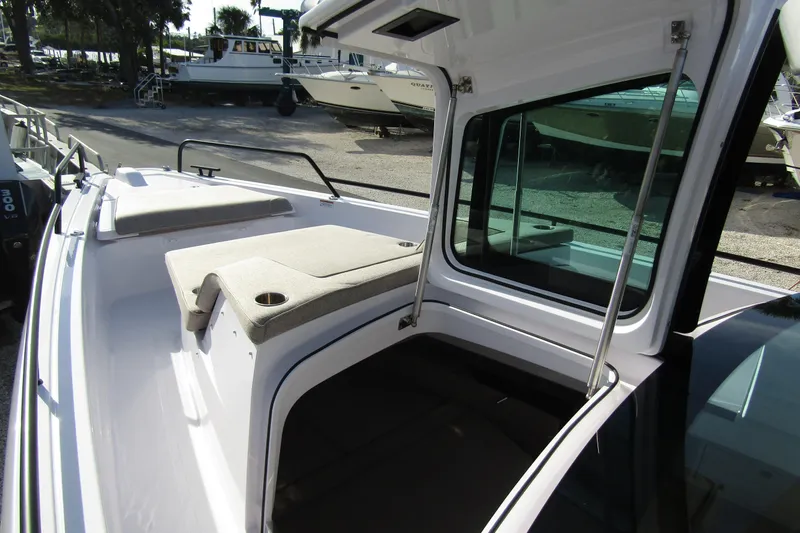  Yacht Photos Pics 2024 Axopar 45 XC Cross Cabin BRABUS Trim with open cabin and cushioned seating.