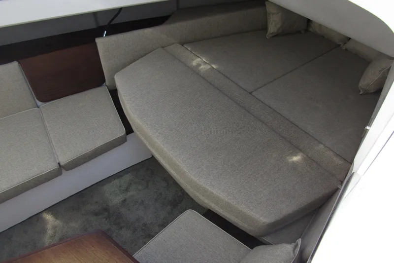  Yacht Photos Pics 2024 Axopar 45 XC Cross Cabin BRABUS Trim interior with gray seating and cushions.