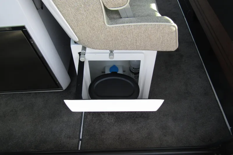  Yacht Photos Pics 2024 Axopar 45 XC Cross Cabin BRABUS Trim interior storage compartment.