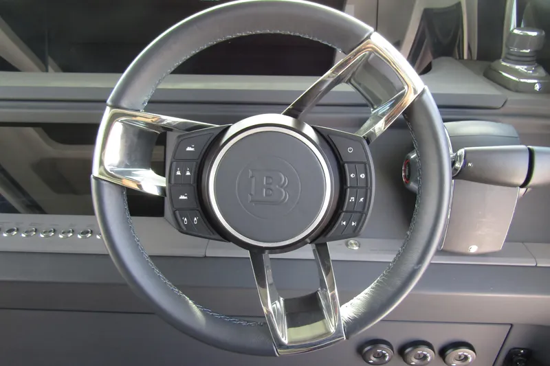  Yacht Photos Pics Steering wheel of 2024 Axopar 45 XC Cross Cabin BRABUS Trim with control buttons.