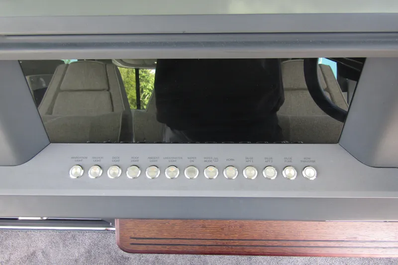  Yacht Photos Pics Control panel of 2024 Axopar 45 XC Cross Cabin BRABUS Trim with labeled buttons.