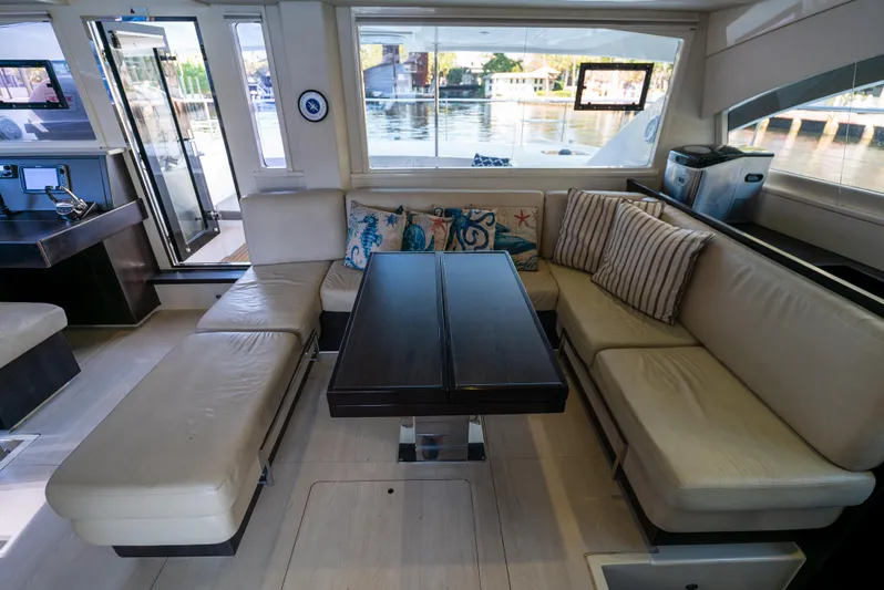  Yacht Photos Pics Luxurious interior of 2014 Leopard 51 Powercat with plush seating and elegant dining area.