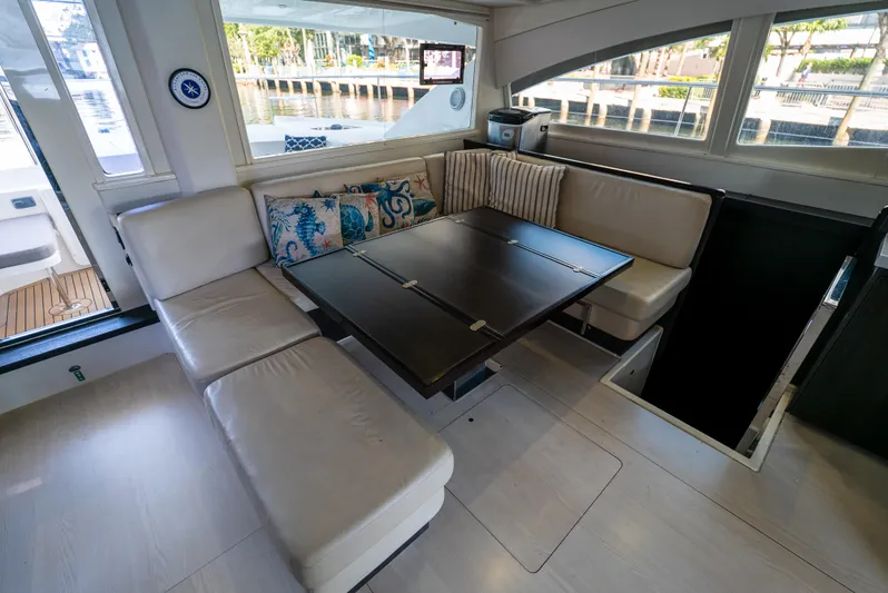  Yacht Photos Pics Interior of 2014 Leopard 51 Powercat with elegant seating and dining area.