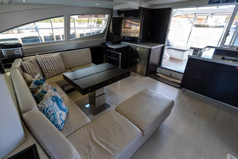  Yacht Photos Pics Luxurious interior of 2014 Leopard 51 Powercat with modern seating and kitchen area.