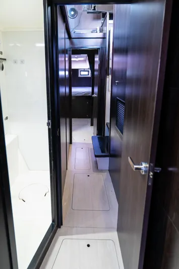  Yacht Photos Pics Interior hallway of 2014 Leopard 51 Powercat yacht, featuring modern design and sleek finishes.