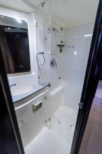  Yacht Photos Pics 2014 Leopard 51 Powercat bathroom with shower, sink, and mirror.