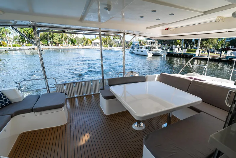  Yacht Photos Pics Spacious deck of 2014 Leopard 51 Powercat with seating, overlooking marina waters.