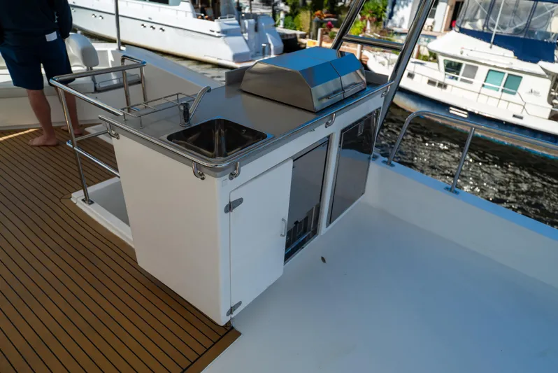  Yacht Photos Pics Outdoor kitchen on 2014 Leopard 51 Powercat yacht with sink and grill.