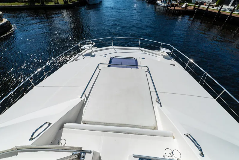  Yacht Photos Pics 2014 Leopard 51 Powercat yacht deck overlooking serene waterway.