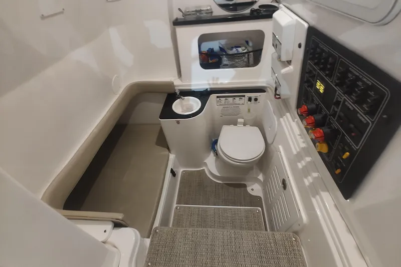  Yacht Photos Pics 2017 Sea Fox 328 Commander interior with toilet, sink, and control panel.