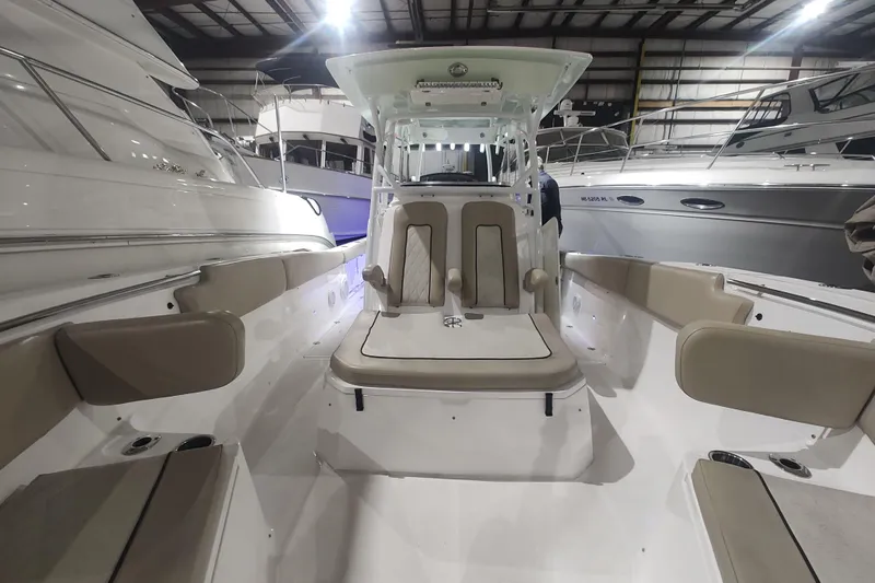  Yacht Photos Pics 2017 Sea Fox 328 Commander boat interior with seating, displayed in a showroom.