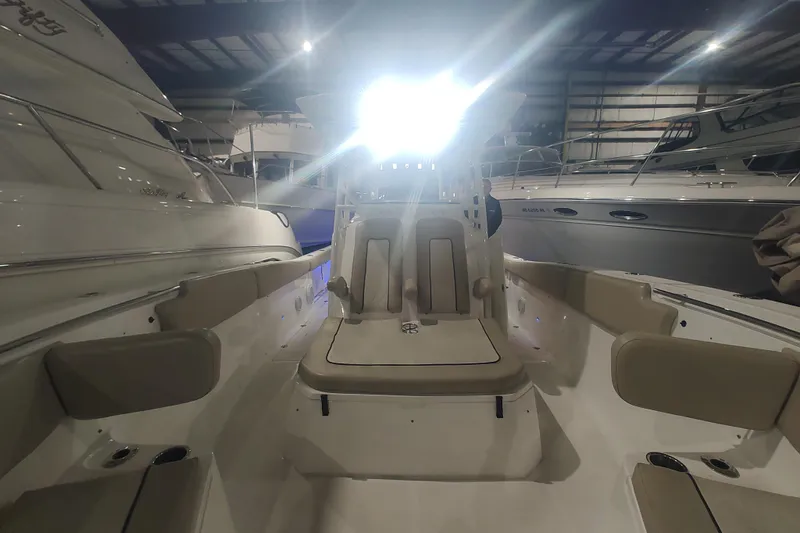  Yacht Photos Pics 2017 Sea Fox 328 Commander boat interior in a dimly lit showroom.