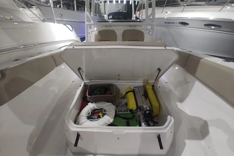  Yacht Photos Pics 2017 Sea Fox 328 Commander boat storage compartment with safety equipment and gear.