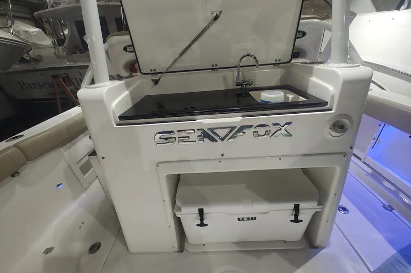  Yacht Photos Pics 2017 Sea Fox 328 Commander boat interior with sink and storage area.