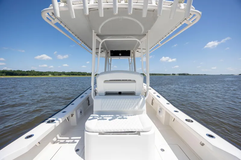  Yacht Photos Pics 2023 Calcutta 263 boat on open water under clear blue sky.