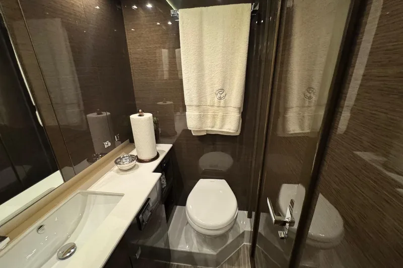  Yacht Photos Pics Luxurious bathroom in 2019 Cruisers Yachts 50 Cantius with modern fixtures and elegant design.