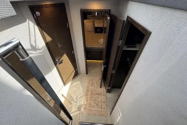  Yacht Photos Pics Interior view of 2019 Cruisers Yachts 50 Cantius, featuring hallway and cabin doors.