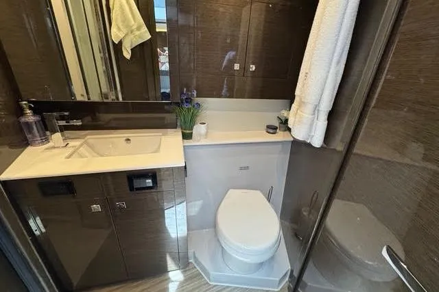  Yacht Photos Pics Luxurious bathroom in 2019 Cruisers Yachts 50 Cantius with modern fixtures and elegant design.