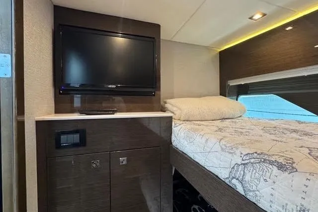  Yacht Photos Pics 2019 Cruisers Yachts 50 Cantius interior with TV and cozy bed.