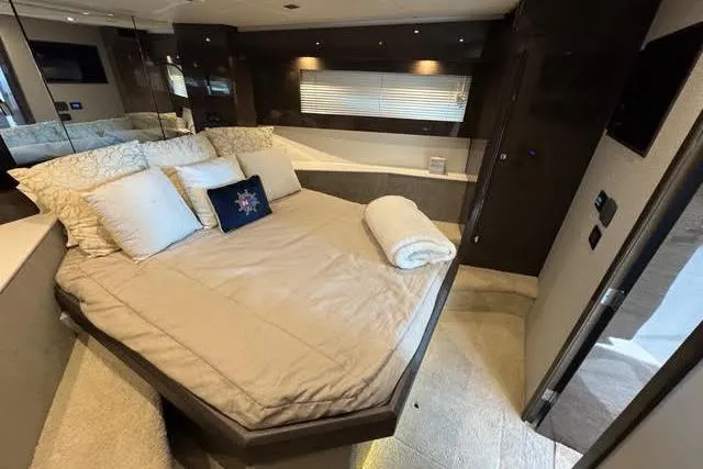  Yacht Photos Pics Luxurious bedroom interior of 2019 Cruisers Yachts 50 Cantius with elegant bedding and modern design.