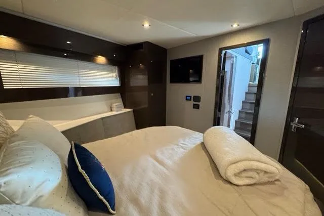  Yacht Photos Pics Luxurious bedroom interior of 2019 Cruisers Yachts 50 Cantius with modern design and cozy bedding.