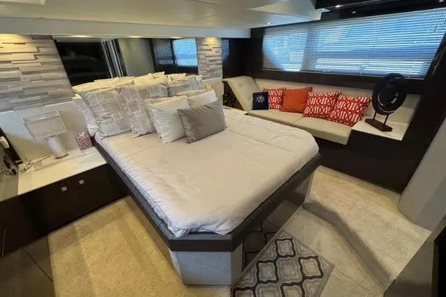  Yacht Photos Pics Luxurious bedroom interior of 2019 Cruisers Yachts 50 Cantius with modern decor and cozy seating.
