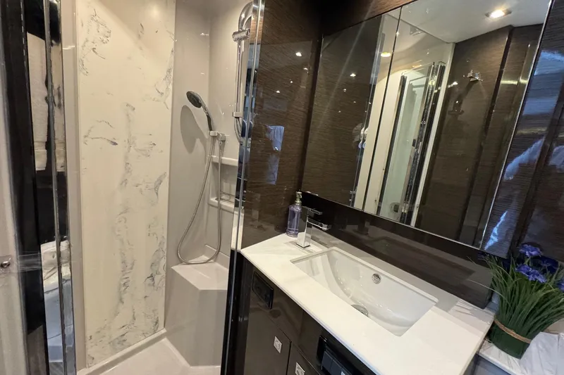  Yacht Photos Pics Luxurious bathroom in 2019 Cruisers Yachts 50 Cantius with modern fixtures and elegant design.