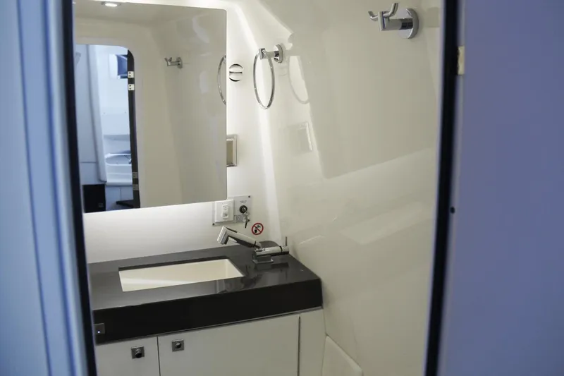  Yacht Photos Pics 2023 Aviara AV40 OB boat bathroom with modern sink and mirror.