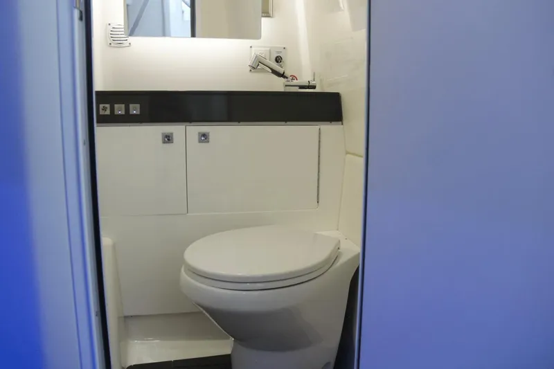  Yacht Photos Pics 2023 Aviara AV40 OB boat bathroom with modern fixtures and sleek design.