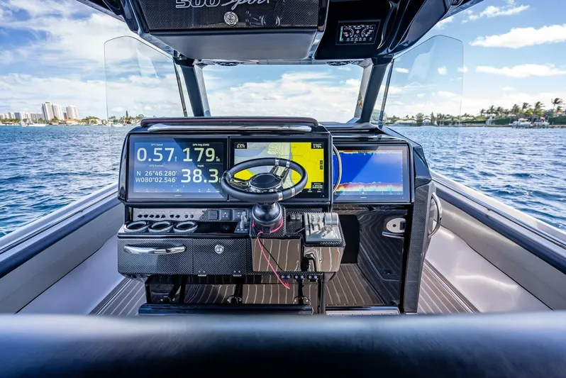  Yacht Photos Pics 2023 Nor-Tech 500 Sport boat cockpit with advanced navigation displays on open water.