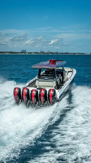  Yacht Photos Pics 2023 Nor-Tech 500 Sport boat with multiple engines cruising on open water.