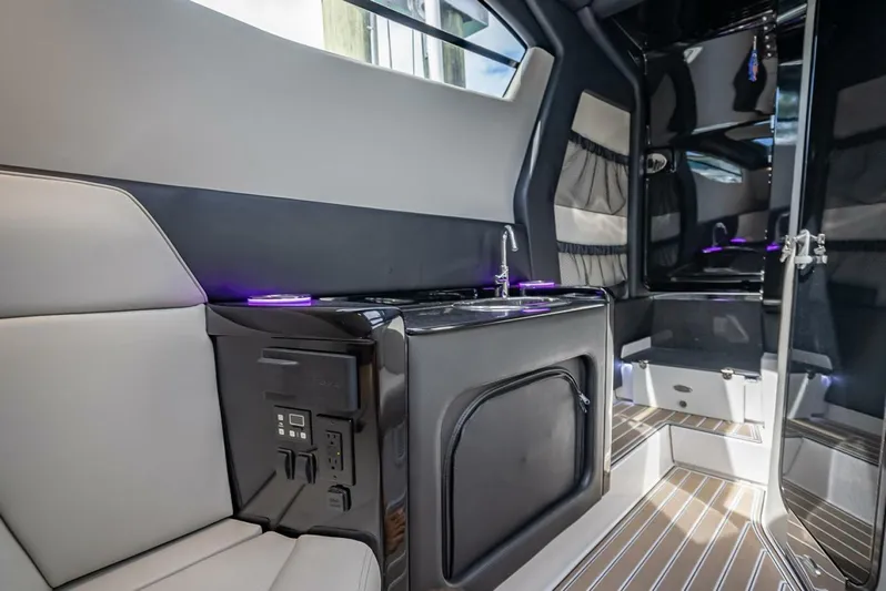  Yacht Photos Pics Luxurious interior of 2023 Nor-Tech 500 Sport boat with modern amenities and sleek design.