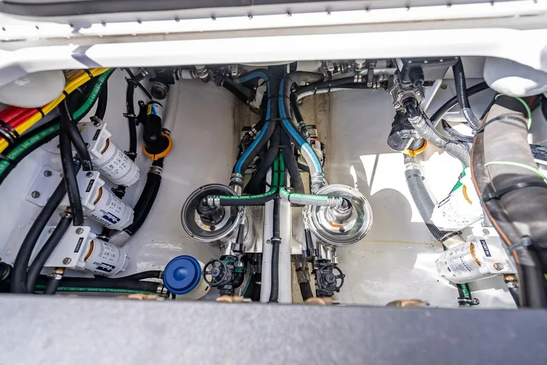  Yacht Photos Pics Engine compartment of 2023 Nor-Tech 500 Sport boat, showcasing intricate wiring and components.