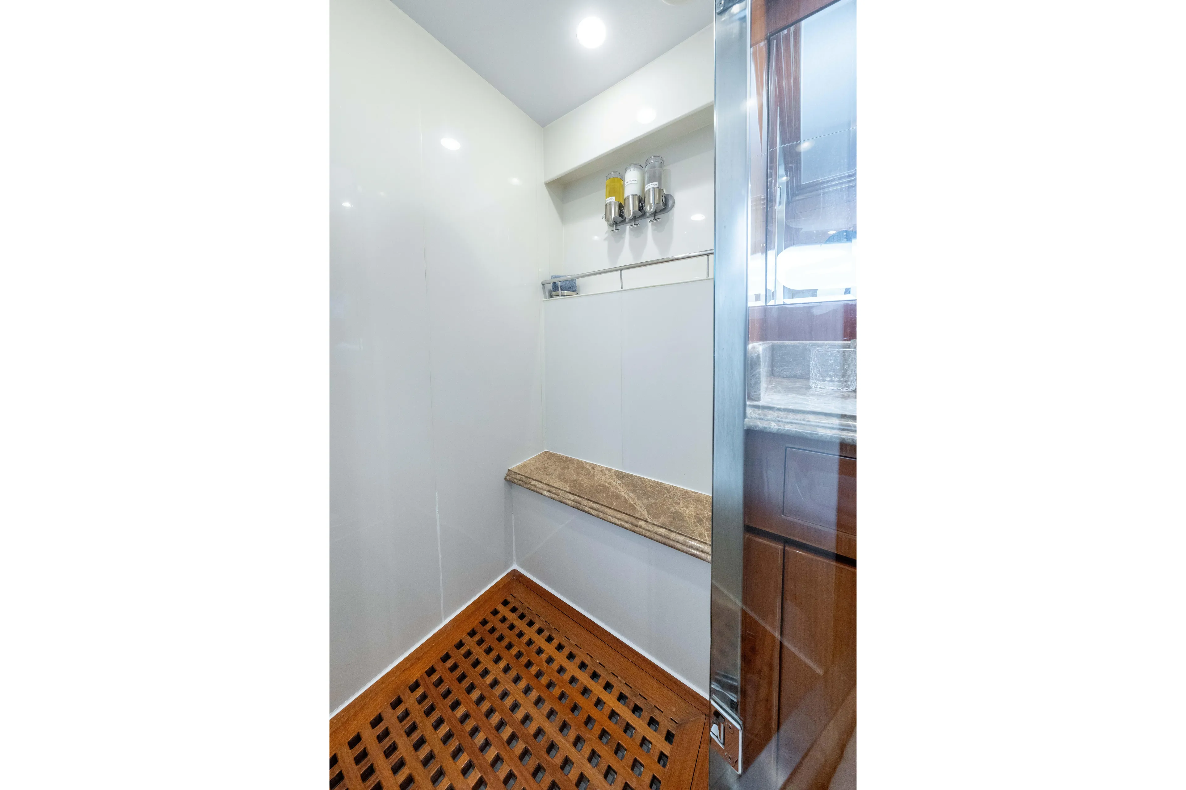  Yacht Photos Pics Luxurious shower area in 2009 Hargrave Raised Pilothouse yacht with wooden flooring.