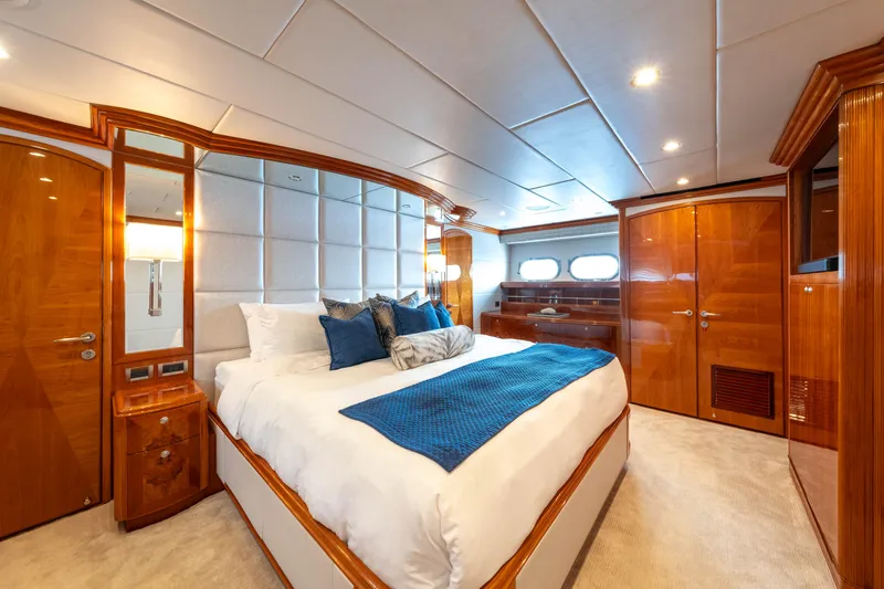  Yacht Photos Pics Luxurious bedroom interior of 2009 Hargrave Raised Pilothouse yacht with elegant wood finishes.
