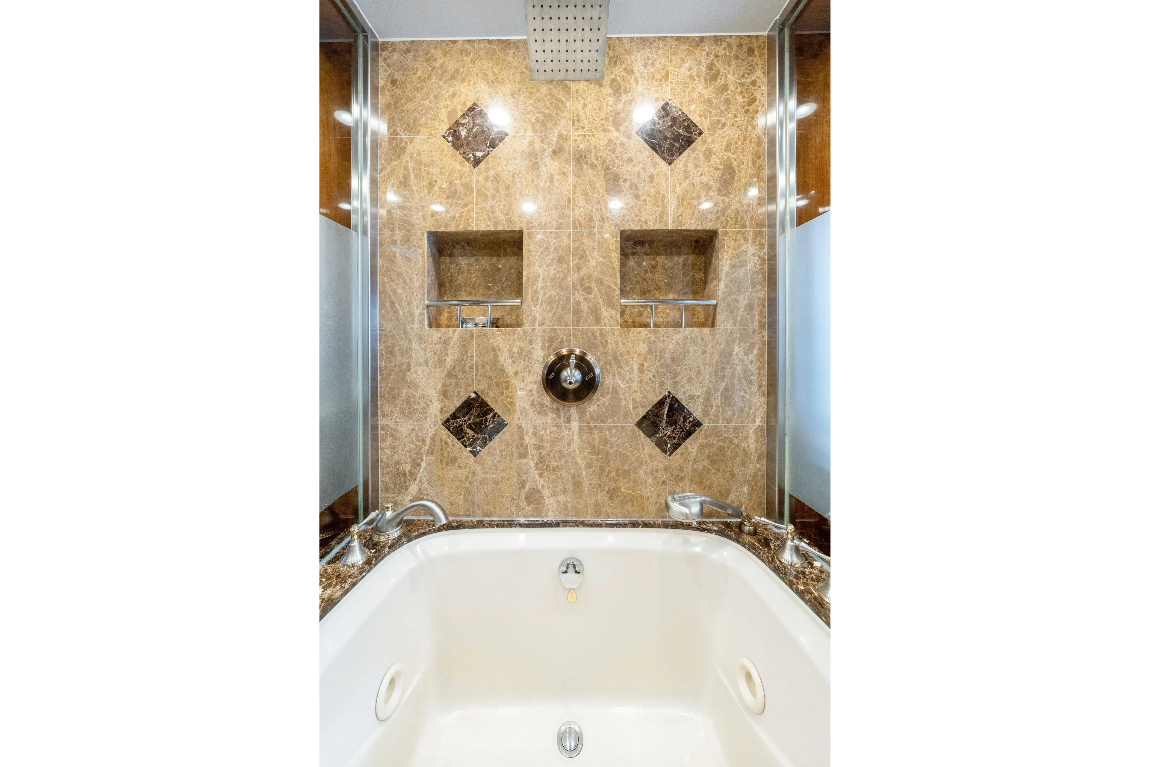  Yacht Photos Pics Luxurious marble bathroom in 2009 Hargrave Raised Pilothouse yacht, featuring elegant fixtures.