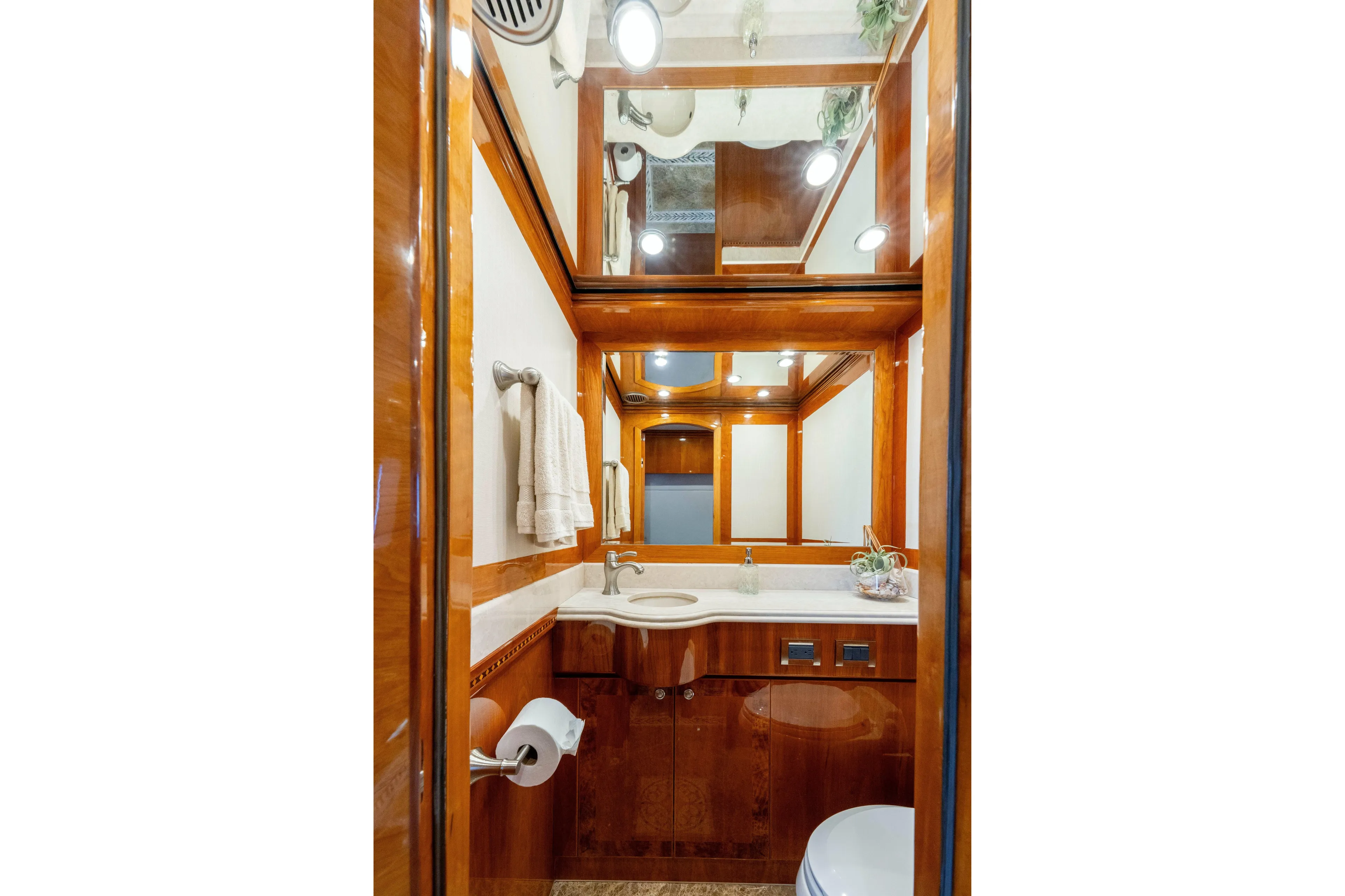 Yacht Photos Pics Luxurious 2009 Hargrave Raised Pilothouse yacht bathroom with wood accents and elegant fixtures.