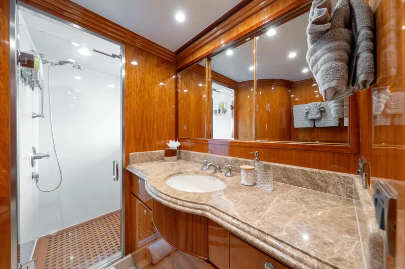  Yacht Photos Pics Luxurious bathroom in 2009 Hargrave Raised Pilothouse yacht with marble countertop and glass shower.