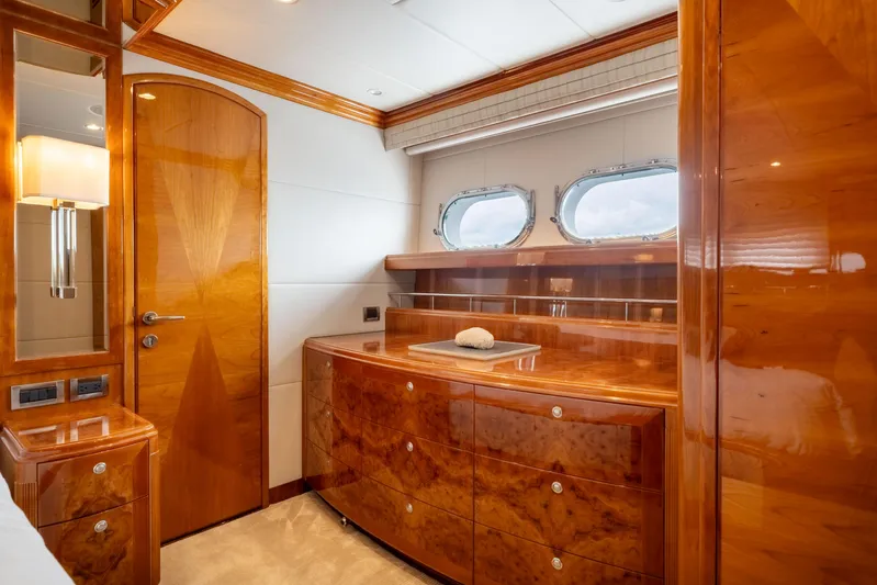  Yacht Photos Pics Luxurious wooden interior of 2009 Hargrave Raised Pilothouse yacht cabin with porthole windows.