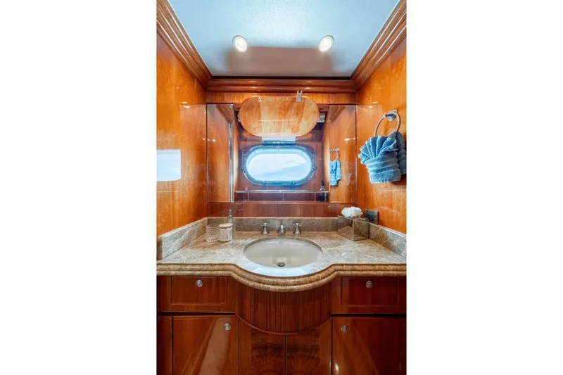  Yacht Photos Pics Luxurious 2009 Hargrave Raised Pilothouse yacht bathroom with wood paneling and marble countertop.